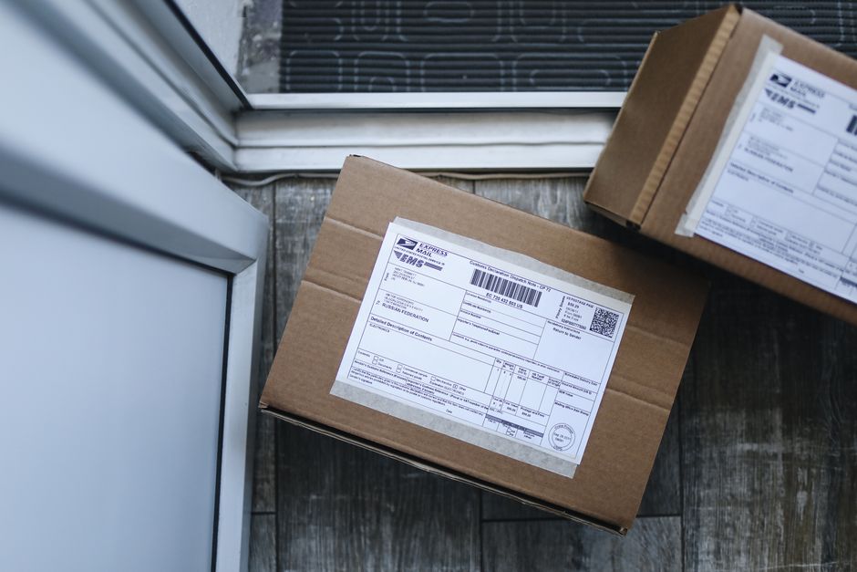 Package delivery box left on a doorstep after online shopping
